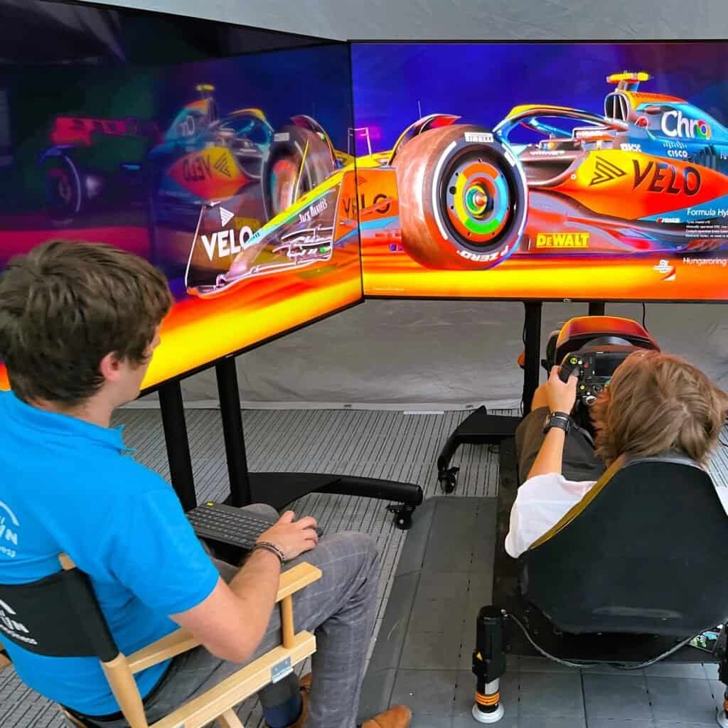 McLaren Velo Formula 1 live race broadcast event with a RoarFun Formula simulator including 3real screen and stunning F1 McLaren wallpaper.