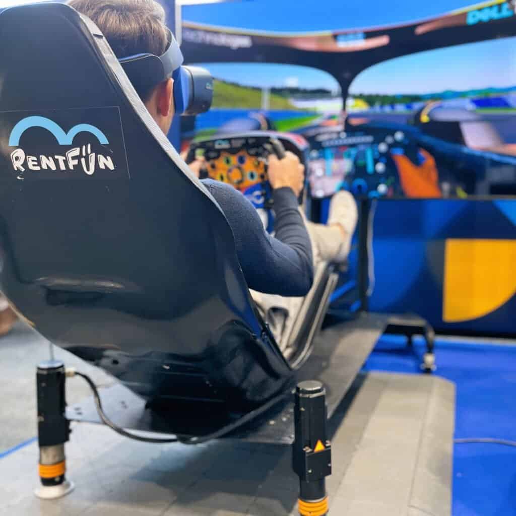 Man drives a professional VR motion simulator with high fidelity virtual reality rented in Oxford, UK.