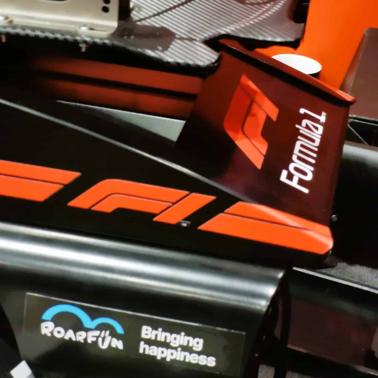 Formula 1 licensed seat on a motion simulator with RoarFun branding.