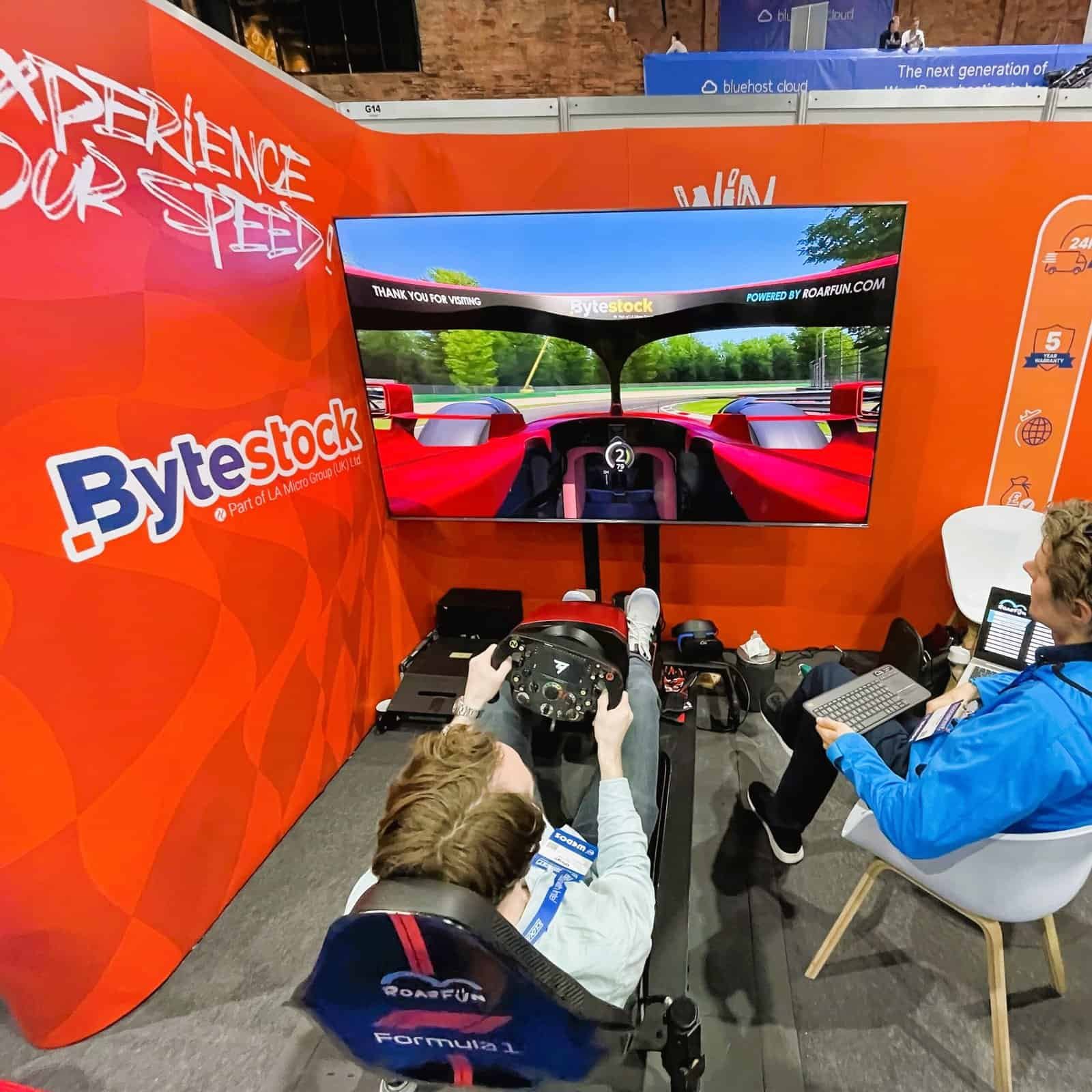 RoarFun stand with Formula 1 licensed simulator at a CloudFest it conference.