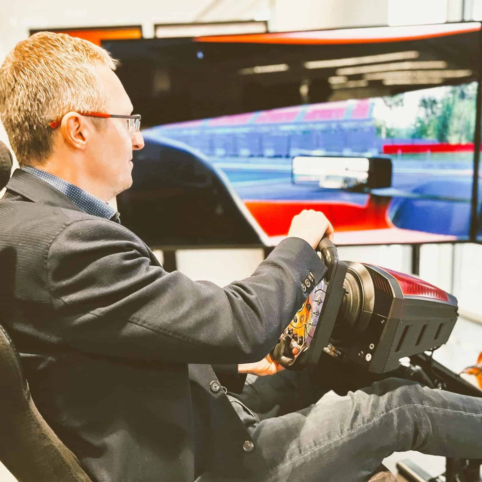 Arrow conference with F1 racing motion simulator with 3 screens.