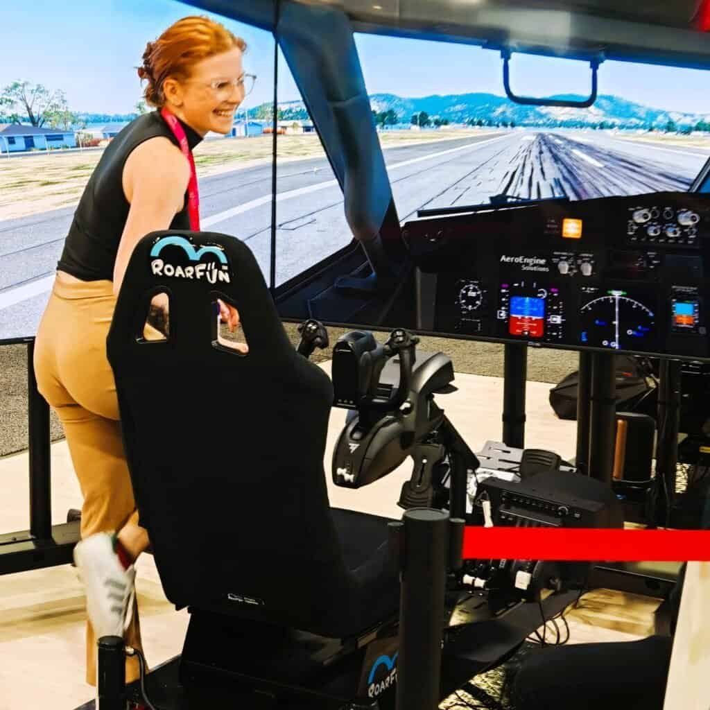 Happy girl with our mobile flight simulator for rent in Atlanta Georgia USA Aviation week.