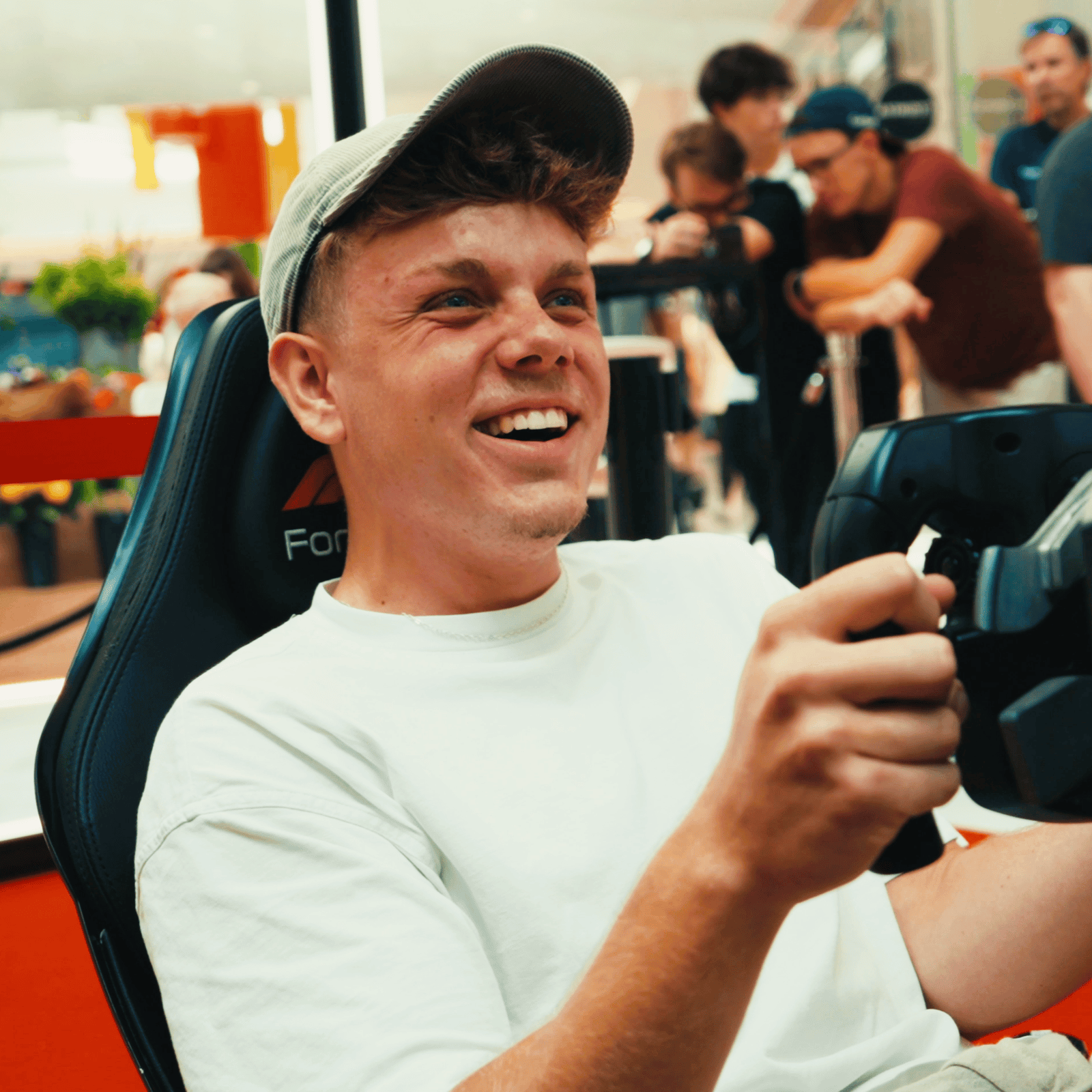 Happy man on a formula simulators rental with 3Real motion Formula simulator for a Westfield Mall Brand Activation.
