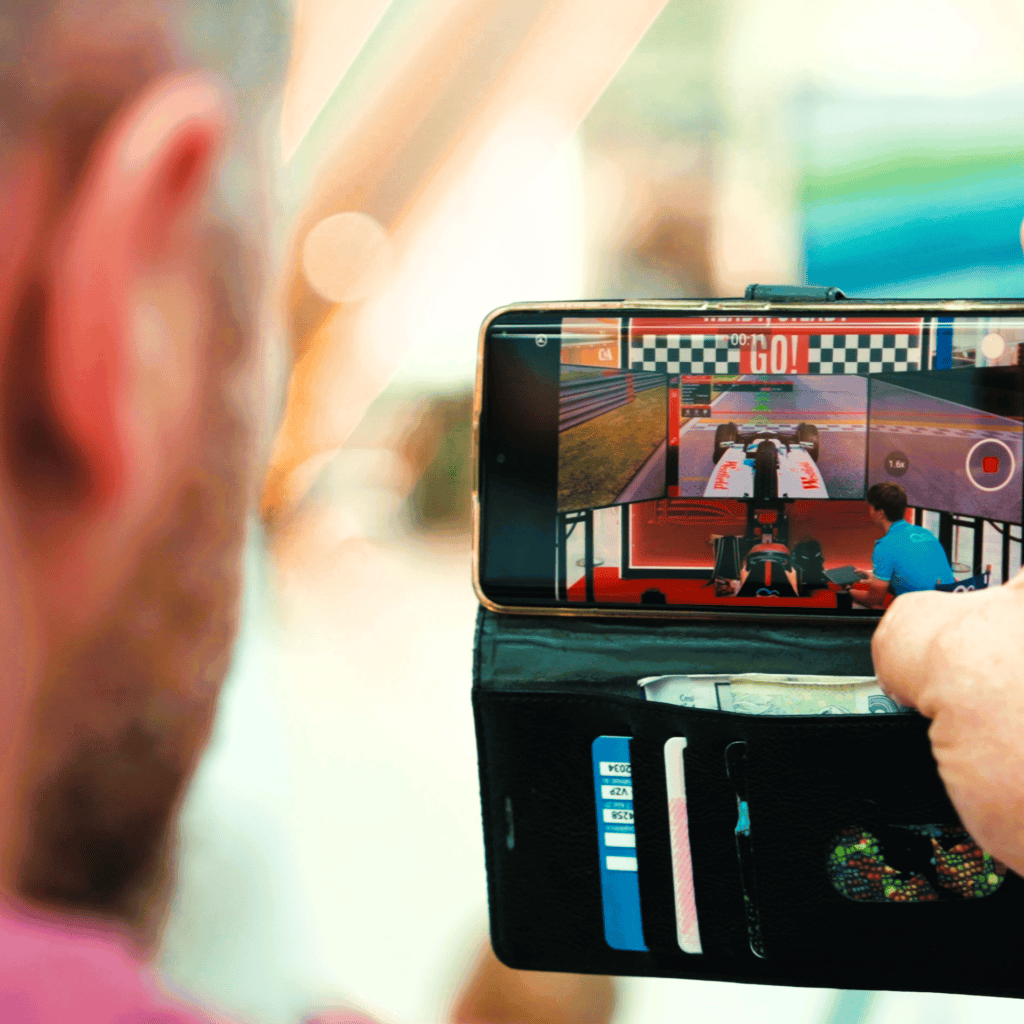 Man taking photo of a simulator with RoarFun simulator.